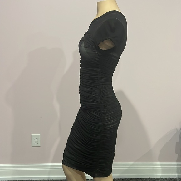 Never worn BCBG mesh overlay black dress asymmetrical designs underneath size XS - Picture 2 of 5